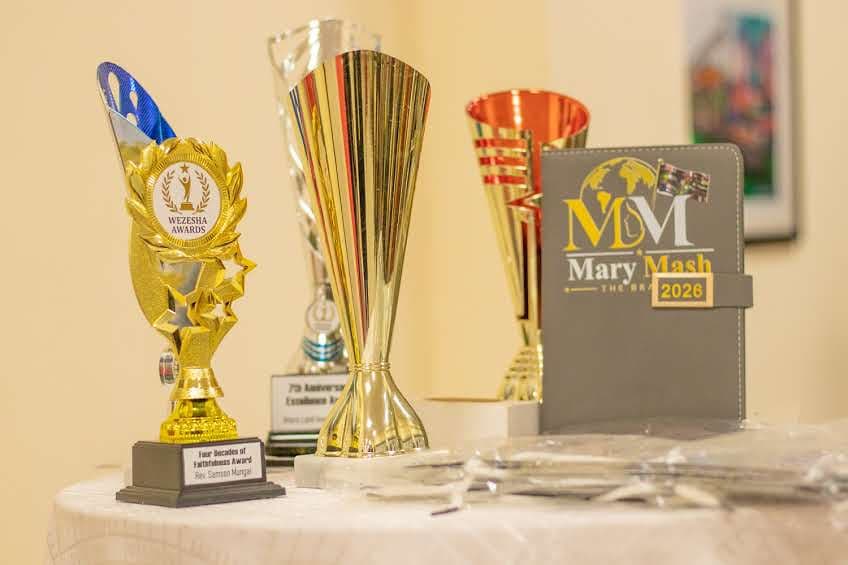 Wezesha Awards trophies beside the Mary Mash 2026 plaque