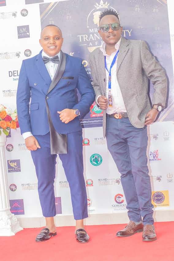 Guests arriving on the red carpet in front of the sponsor backdrop