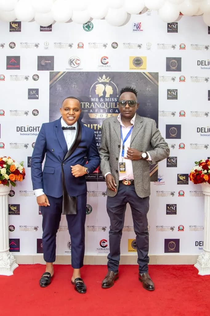 Two guests on the red carpet in front of the Mr & Miss Tranquility Africa backdrop