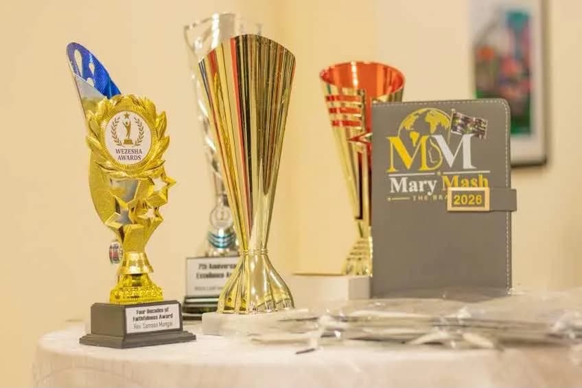 A Wezesha Awards trophy beside the Mary Mash 2026 journal